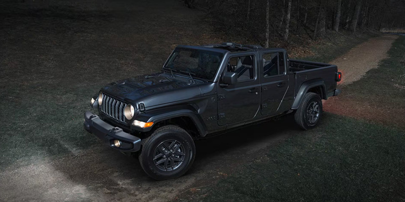 2026 Jeep® Gladiator pickup truck driving off-road.